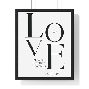 We Love framed Christian wall art inspired by 1 John 4:19, black frame with black and white scripture typography