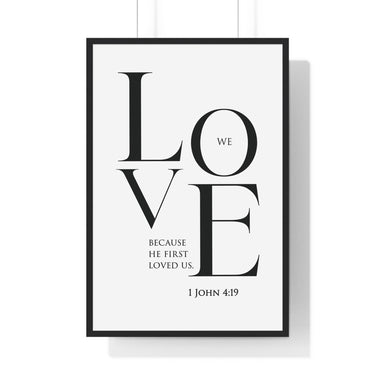 We Love framed Christian wall art inspired by 1 John 4:19, black frame with black and white scripture typography