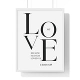 We Love framed Christian wall art inspired by 1 John 4:19, black frame with black and white scripture typography