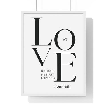 We Love framed Christian wall art inspired by 1 John 4:19, black frame with black and white scripture typography