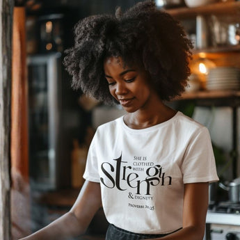 Woman wearing a white t-shirt with text in a kitchen setting
