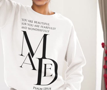White sweatshirt with black text and design on a plain background