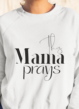White sweatshirt with 'This Mama Prays' text on a plain background